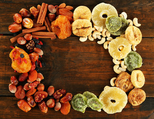 Assortment of dried fruits on wooden table, closeup