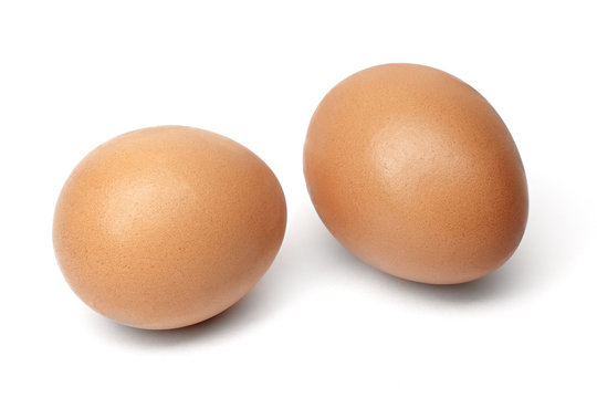 Two chiken eggs isolated on white background