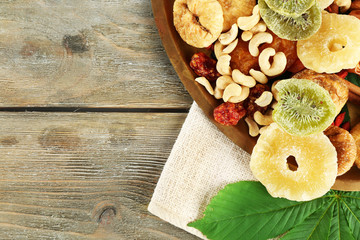 Assortment of dried fruits on wooden table, closeup