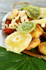 Assortment of dried fruits on wooden table, closeup