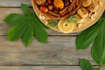 Assortment of dried fruits on wooden table, closeup