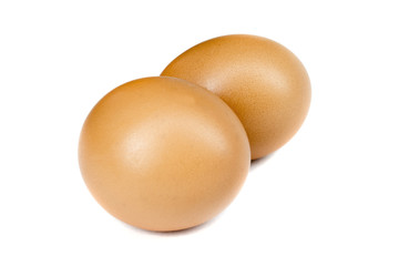 Two chiken eggs isolated on white background