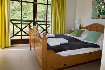 Double bed in the modern interior room