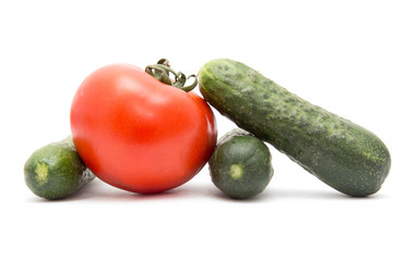 cucumbers and tomatoes on a white background