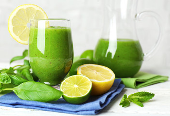 Fototapeta premium Healthy green smoothie on wooden table, closeup