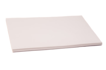 close up of stack of papers on white background