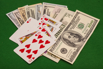 Royal Flush Hearts And Dollar Money On Green Felt
