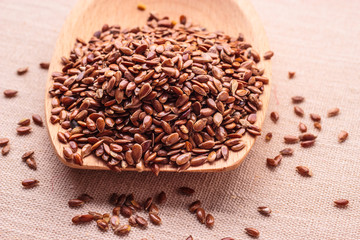 Flax seeds linseed on wooden spoon