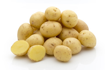 Potatoes on the white background.  New harvest.