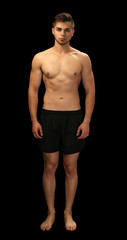 Muscle young man on dark background