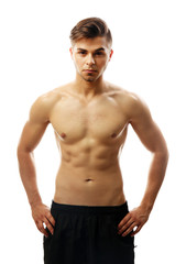 Fototapeta premium Muscle young man isolated on white