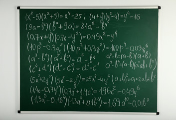 Math formulas on blackboard background