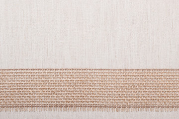 Jute ribbon on linen cloth background