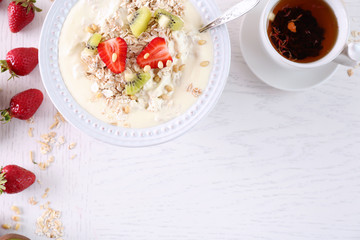 Healthy homemade oatmeal on wooden table, close up