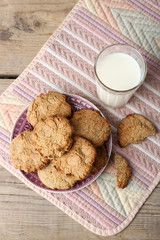 Homemade cookies and glass of milk on table close up
