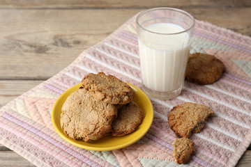 Homemade cookies and glass of milk on table close up