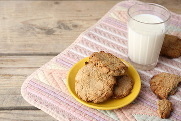 Homemade cookies and glass of milk on table close up