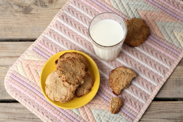 Homemade cookies and glass of milk on table close up