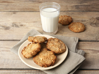 Homemade cookies and glass of milk on table close up