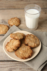 Homemade cookies and glass of milk on table close up