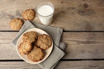 Homemade cookies and glass of milk on table close up