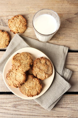 Homemade cookies and glass of milk on table close up