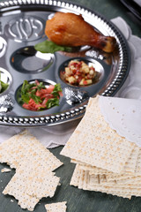Matzo for Passover with Seder meal on plate on table close up