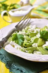 Fried zucchini with feta and chopped parsley.