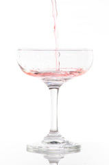 orange cocktail in glass isolated on white background