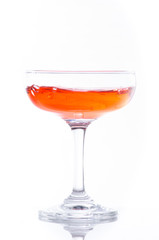 orange cocktail in glass isolated on white background