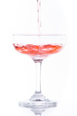 orange cocktail in glass isolated on white background