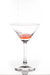 orange cocktail in glass isolated on white background