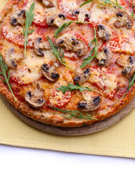 Tasty pizza with vegetables and napkin close up