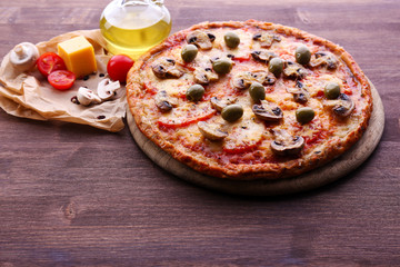 Tasty pizza with vegetables and cheese on table close up