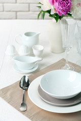 Beautiful table setting with flowers in vase close up