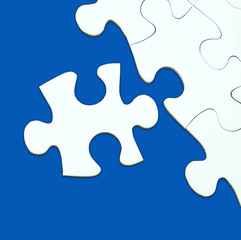 Jigsaw puzzle on blue background for business concepts template.