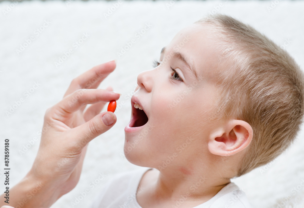 Sticker Child receiving pill - closeup