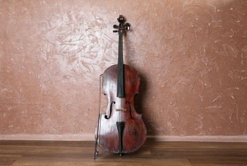 Cello on brown wall background © Africa Studio