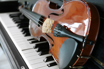 Violin on piano keys, closeup