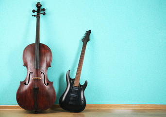 Musical instruments on turquoise wallpaper background
