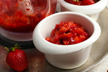 Ripe strawberries in blender on metal tray, closeup