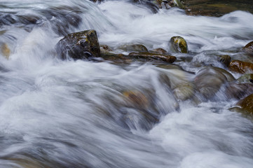 Closeup of flowing water over rocks/Closeup of flowing water over rocks from the Sacramento River