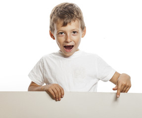 little cute boy holding empty shit to copyspace isolated