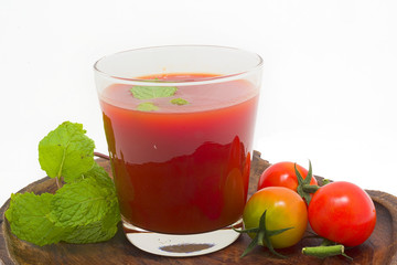 Fresh tomato juice isolated on white background