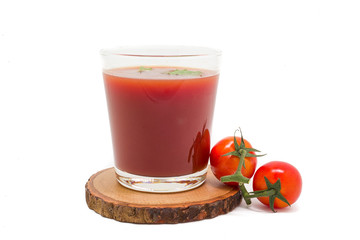 Fresh tomato juice isolated on white background