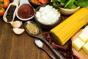 Raw spaghetti Ingredients on wooden table