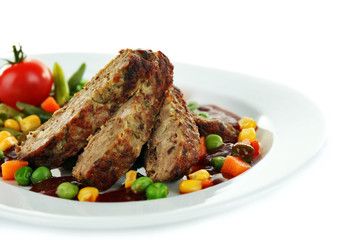 Tasty slices of meat with vegetables on plate isolated on white