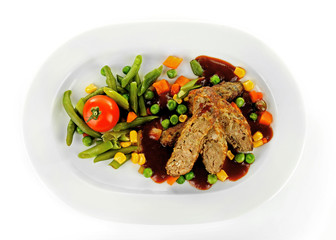Tasty slices of meat with vegetables on plate isolated on white