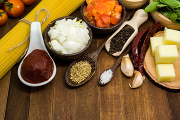 Raw spaghetti Ingredients on wooden table