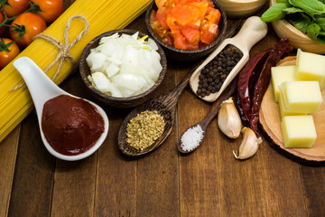 Raw spaghetti Ingredients on wooden table